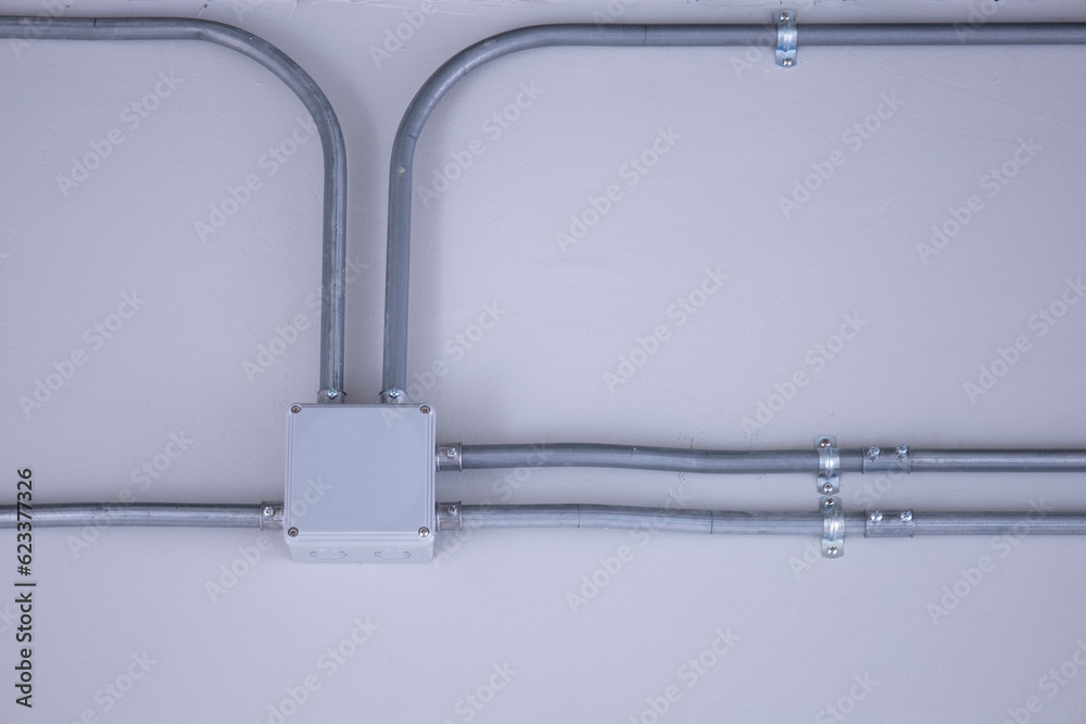 Electrical junction box and conduits on the wall. Home electrical