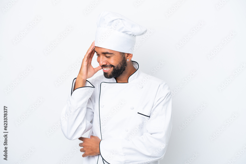 Young Brazilian chef man isolated on white background laughing Young Brazilian chef man isolated on white background laughing