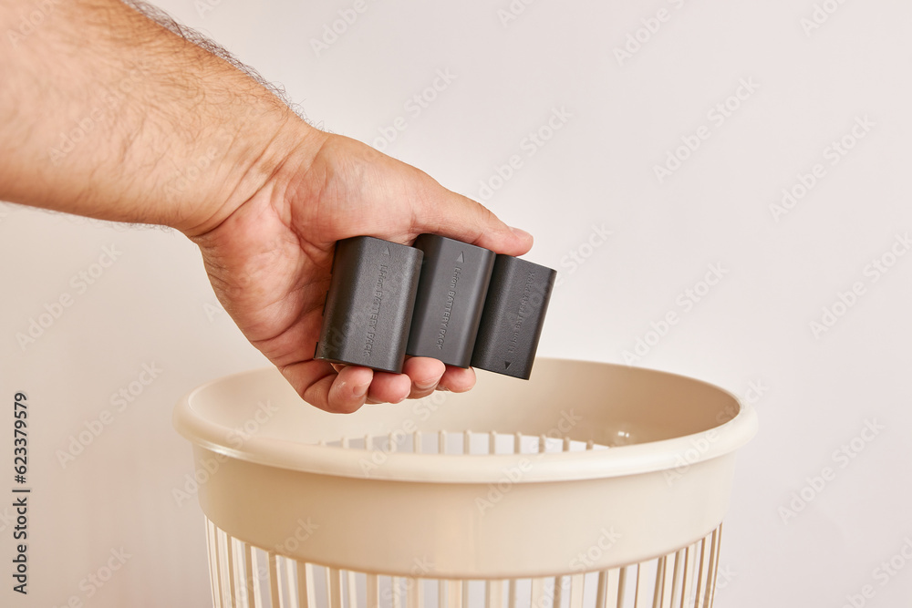 Old batteries are recycled and thrown into the trash. The concept of