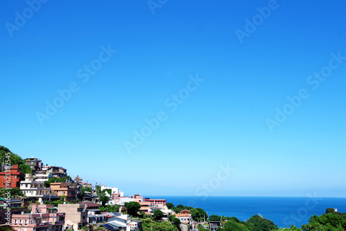 Billede på lærred Coastal Architecture: Clear Sky Horizon and Residential District in Taiwan
