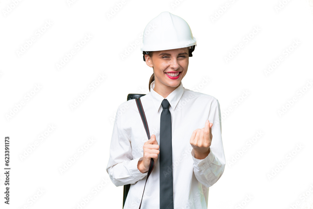 Young architect woman with helmet and holding blueprints over isolated background making money gesture Young architect woman with helmet and holding blueprints over isolated background making money gesture