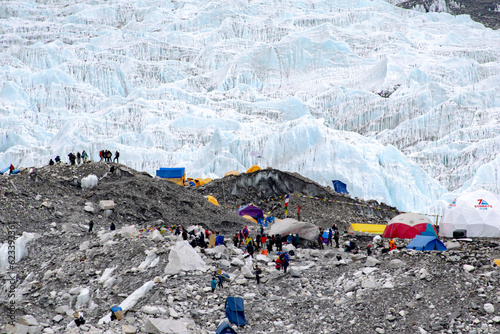 Camps at Everest base camp. World's highest glacier Khumbu glacier and other hanging glaciers on world's highest mountains. Ice, rocks, debris and glaciers seen around everest base camp in nepal.  photo