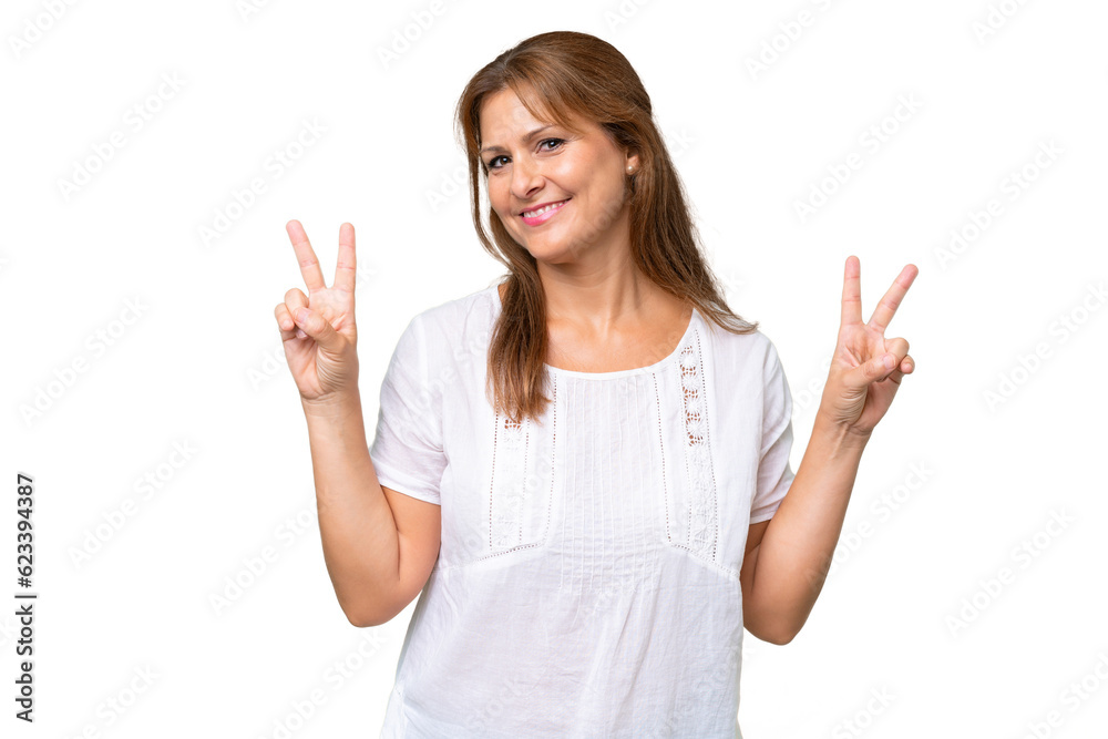 Middle-aged caucasian woman over isolated background showing victory sign with both hands Middle-aged caucasian woman over isolated background showing victory sign with both hands