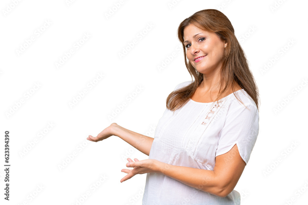 Middle-aged caucasian woman over isolated background extending hands to the side for inviting to come Middle-aged caucasian woman over isolated background extending hands to the side for inviting to come