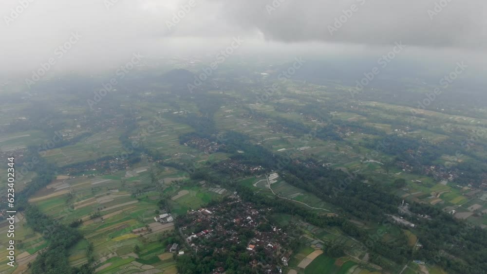Heavy fog over landscape of Indonesia, high altitude drone view Heavy fog over landscape of Indonesia, high altitude drone view