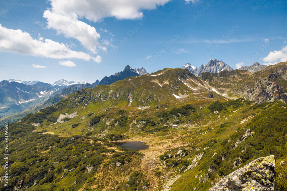 Sunniggrathütte SAC and surrounding mountains in Urner Alpen in summer