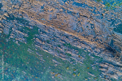 overhead aerial view of a rocky coast in the atlantic ocean