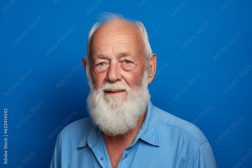 Medium shot portrait photography of a tender old man wearing a casual short-sleeve shirt against a royal blue background. With generative AI technology Medium shot portrait photography of a tender old man wearing a casual short-sleeve shirt against a royal blue background. With generative AI technology