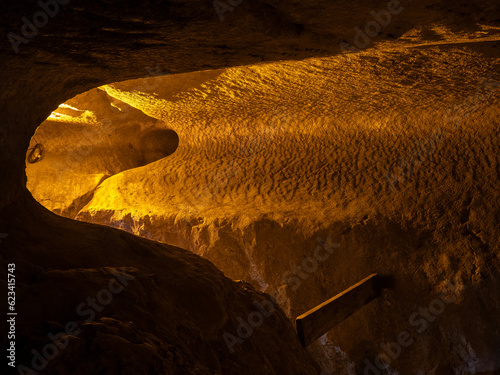 Bolii cave ( Pestera Bolii ), near Petrosani city, Hunedoara county, Romania. The cave is artificially illuminated and is open to visitors. photo