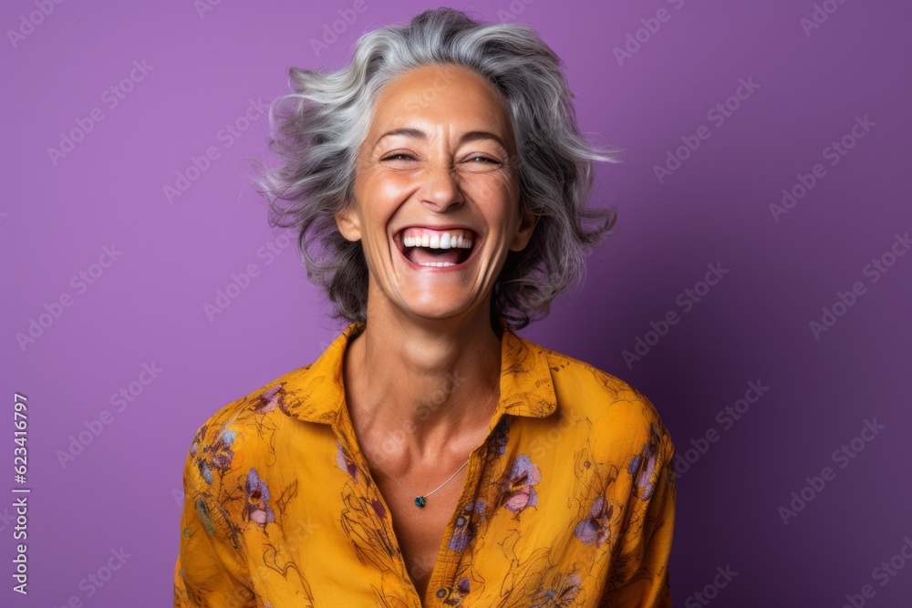 Lifestyle portrait photography of a joyful mature woman wearing a casual short-sleeve shirt against a vibrant purple background. With generative AI technology