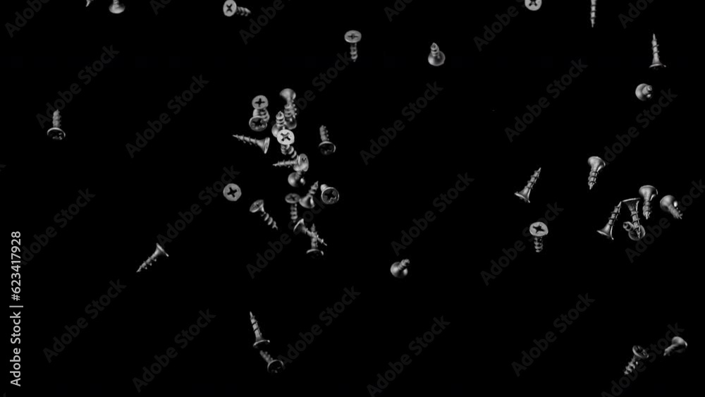 Self-tapping crews are falling down on a black background. Slow motion. Self-tapping crews are falling down on a black background. Slow motion.