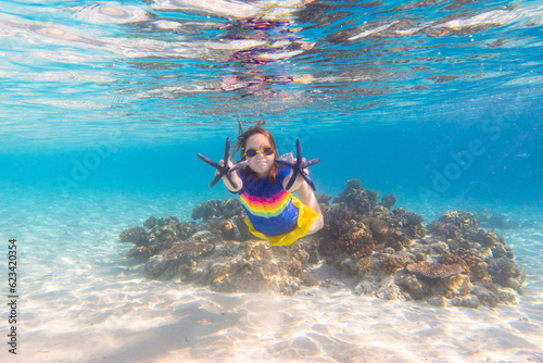 Child snorkeling. Kids underwater. Beach and sea.