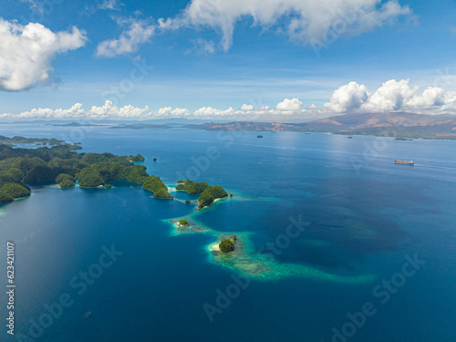 Flying above in Tiktikan Lagoon in Sohoton Cove. Blue water and corals reefs. Bucas Grande Island. Mindanao, Philippines.