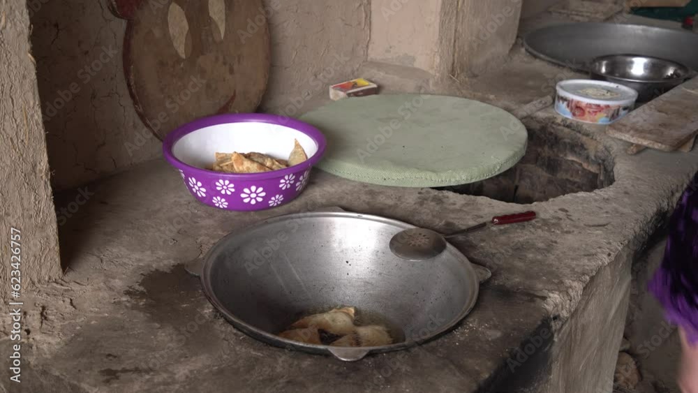 the fried samosa in a vessel in village the fried samosa in a vessel in village
