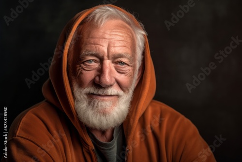 Close-up portrait photography of a satisfied old man wearing a stylish hoodie against a rustic brown background. With generative AI technology