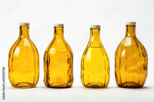 Glass Oil bottles of vegetable oil on a white background. 