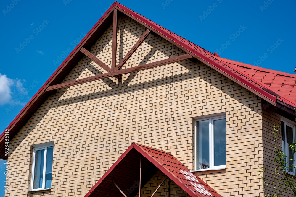 A brick house against the sky.