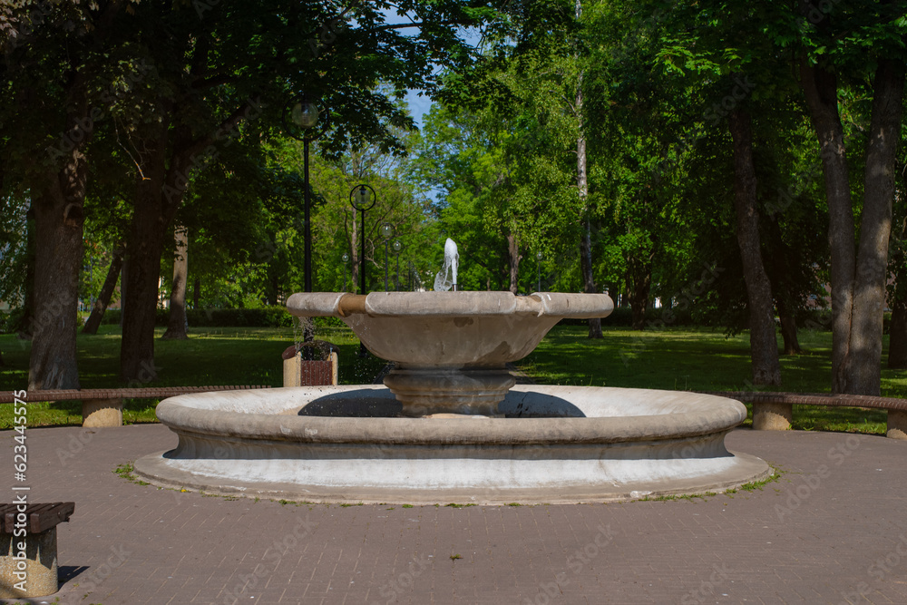 Old fountain in the centre park of a small town Kohtla-Järve on a sunny summer day. Estonia.