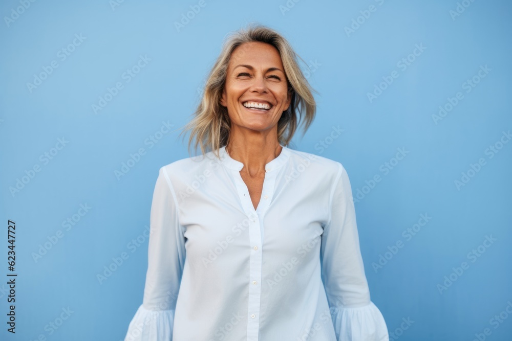 Lifestyle portrait photography of a glad mature woman wearing an elegant long-sleeve shirt against a sky-blue background. With generative AI technology Lifestyle portrait photography of a glad mature woman wearing an elegant long-sleeve shirt against a sky-blue background. With generative AI technology