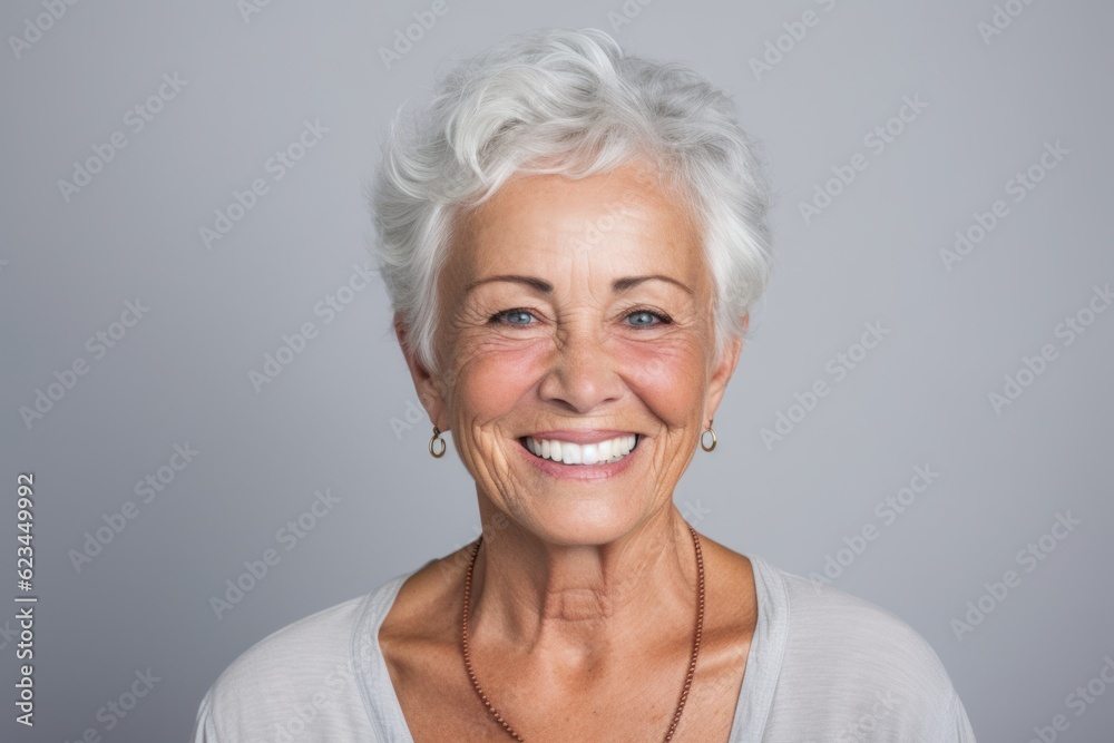 Headshot portrait photography of a satisfied old woman wearing a cute crop top against a cool gray background. With generative AI technology