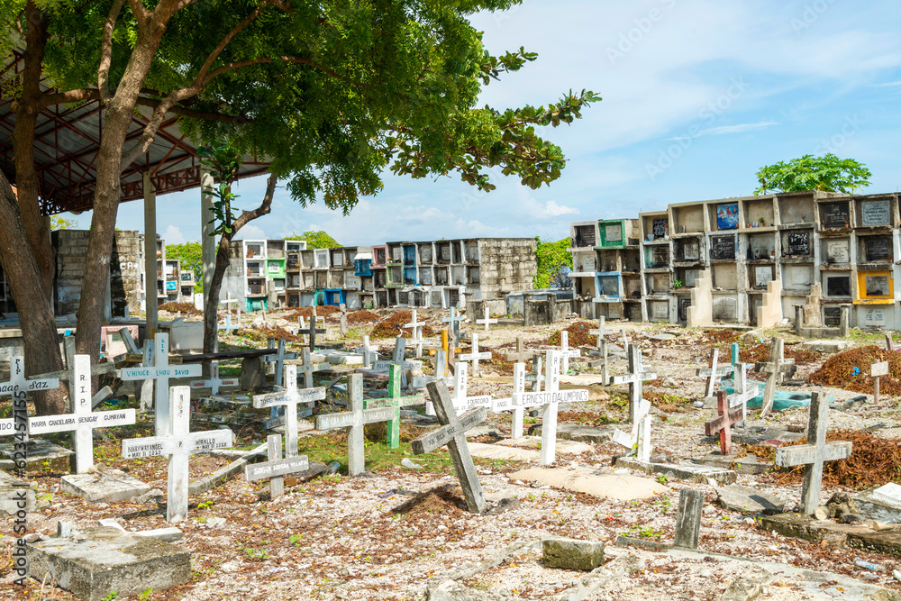 Oslob Public Cemetery,stacked tombs and crowded graveyard,under the