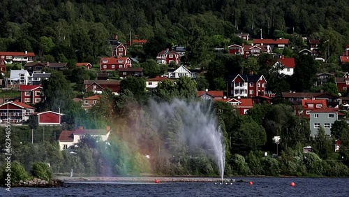 Rattvik, Sweden The large landmark fountain in Lake Siljan and the surrounding town.  photo