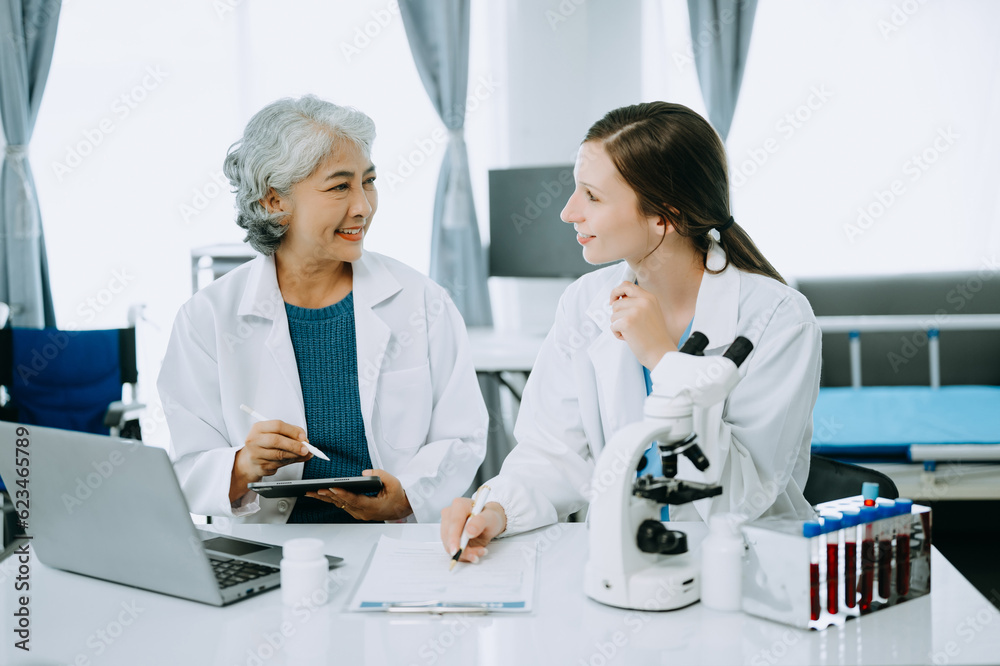 Scientist team meeting and writing analysis results in the laboratory study and analyze scientific sample, test samples Scientist team meeting and writing analysis results in the laboratory study and analyze scientific sample, test samples