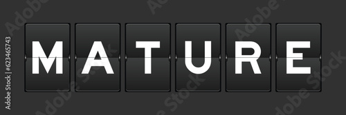 Black color analog flip board with word mature on gray background