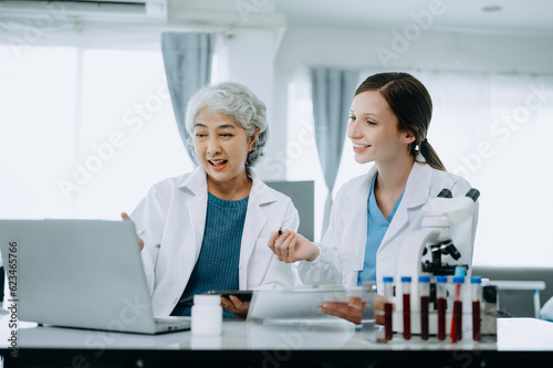 Scientist team meeting and writing analysis results in the laboratory study and analyze scientific sample  test samples