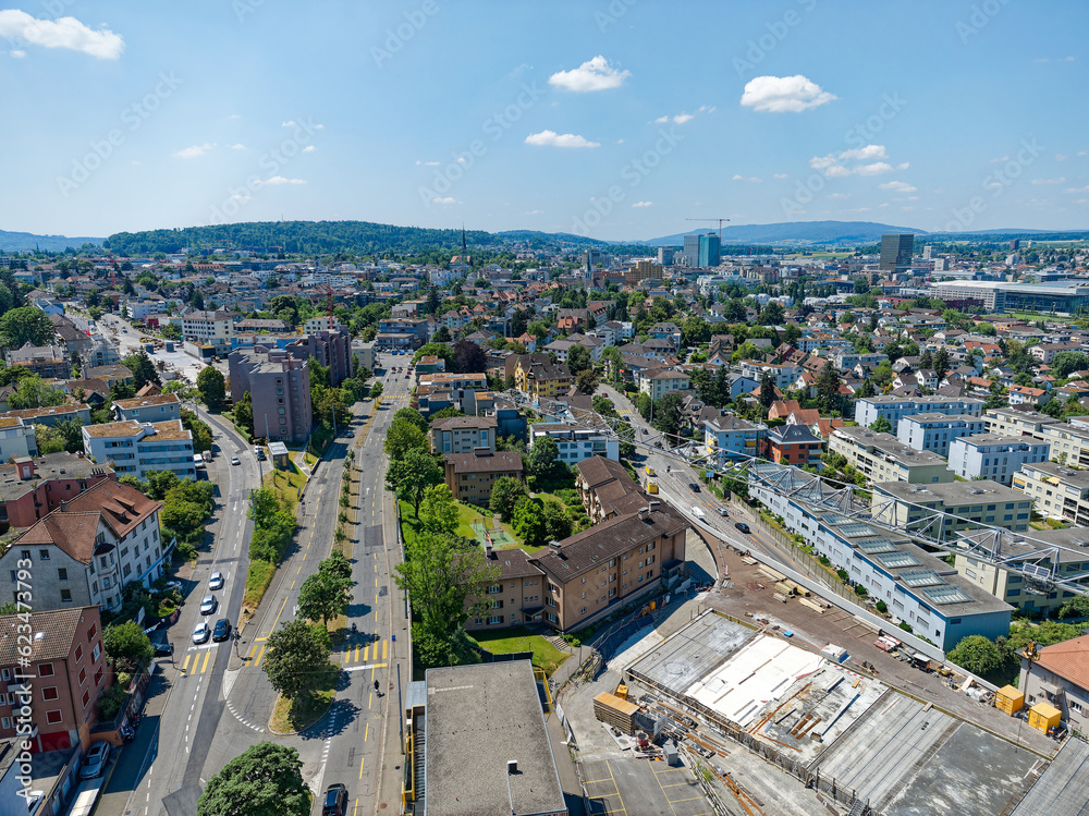 Aerial view of City of Zürich district Schwamendingen with highway enclosure construction site on a sunny summer day. Photo taken June 24th, 2023, Zurich, Switzerland.