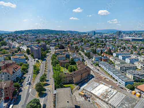 Aerial view of City of Zürich district Schwamendingen with highway enclosure construction site on a sunny summer day. Photo taken June 24th, 2023, Zurich, Switzerland. © Michael Derrer Fuchs