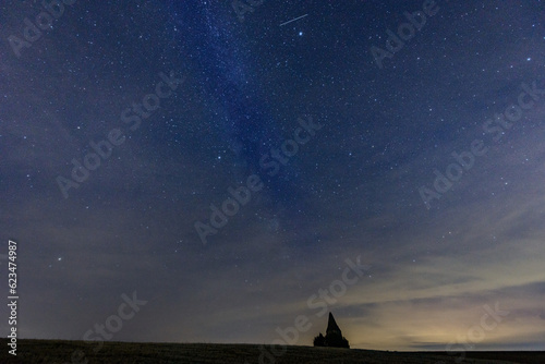 Middle european nightscape near an ancient watchtower. Milkyway, nightsky and stars
