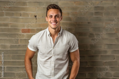 Studio portrait photography of a satisfied boy in his 30s wearing a casual short-sleeve shirt against a spacious loft background. With generative AI technology
