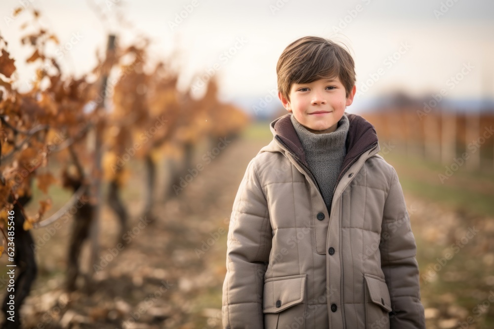 Environmental portrait photography of a glad kid male wearing a cozy winter coat against a picturesque vineyard background. With generative AI technology Environmental portrait photography of a glad kid male wearing a cozy winter coat against a picturesque vineyard background. With generative AI technology
