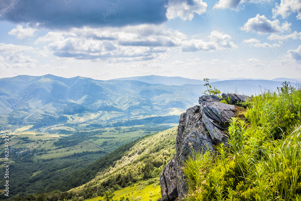 Beautiful view on the Ukrainian Polonynian Beskids to the mountains and valleys. Rocky peaks of the Ukrainian Carpathians in summer. Water-making ridge in the Carpathians, Carpathian mountains Beautiful view on the Ukrainian Polonynian Beskids to the mountains and valleys. Rocky peaks of the Ukrainian Carpathians in summer. Water-making ridge in the Carpathians, Carpathian mountains