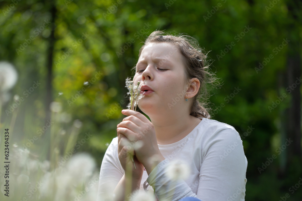 Summer joy - lovely girl blowing dandelion Summer joy - lovely girl blowing dandelion