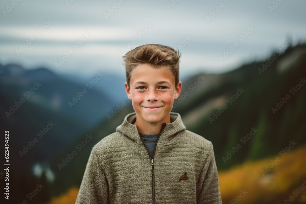 Headshot portrait photography of a joyful boy in his 30s wearing a cozy sweater against a scenic mountain overlook background. With generative AI technology