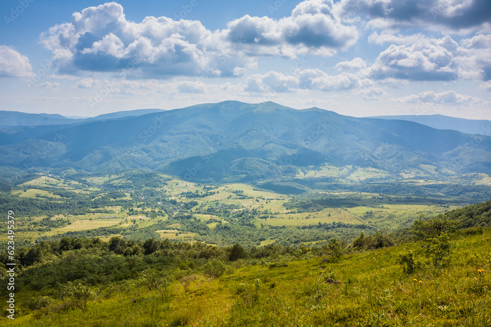 Beautiful view from the Ukrainian Polonynian Beskids to the mountains and valleys. Rocky peaks of the Ukrainian Carpathians in summer. Water-making ridge in the Carpathians, Carpathian mountains