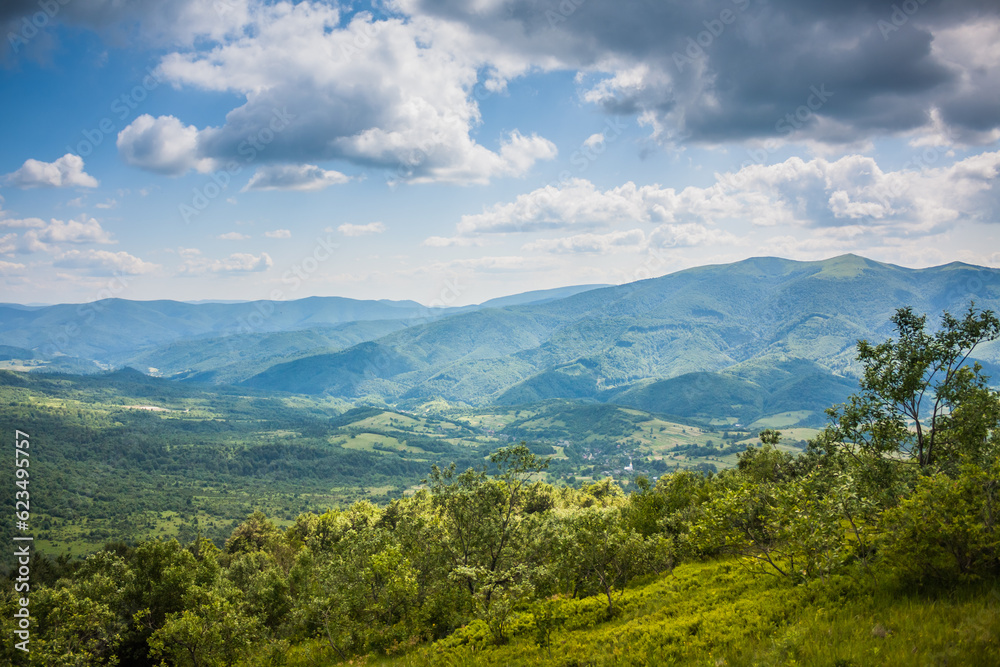 Beautiful view from the Ukrainian Polonynian Beskids to the mountains and valleys. Rocky peaks of the Ukrainian Carpathians in summer. Water-making ridge in the Carpathians, Carpathian mountains Beautiful view from the Ukrainian Polonynian Beskids to the mountains and valleys. Rocky peaks of the Ukrainian Carpathians in summer. Water-making ridge in the Carpathians, Carpathian mountains