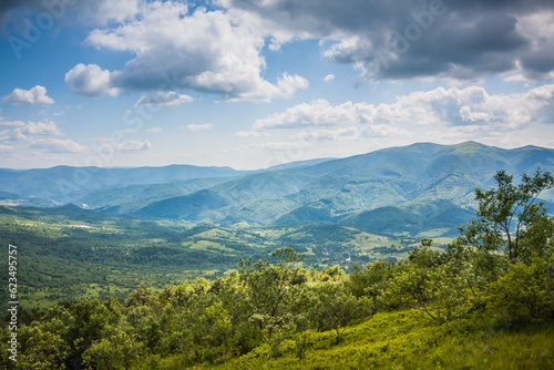 Beautiful view from the Ukrainian Polonynian Beskids to the mountains and valleys. Rocky peaks of the Ukrainian Carpathians in summer. Water-making ridge in the Carpathians, Carpathian mountains