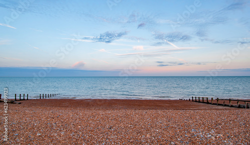 Clouds at sunset at Pevensey Bay beach photo