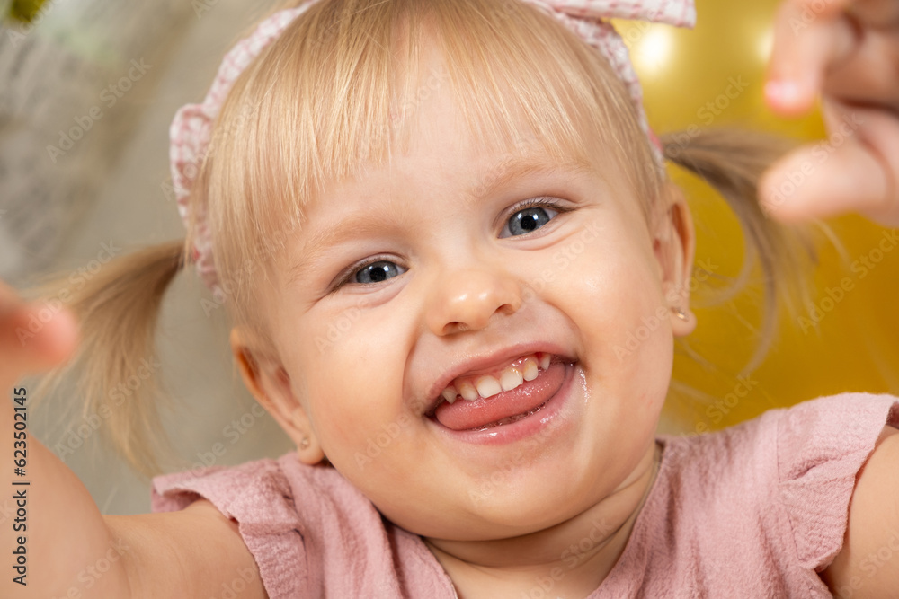 Two year old Girl Smiling Looking At The Camera Sticking Out Her 200-2-year-old-birthday-quotes-for-boys-and-girls-genthirty