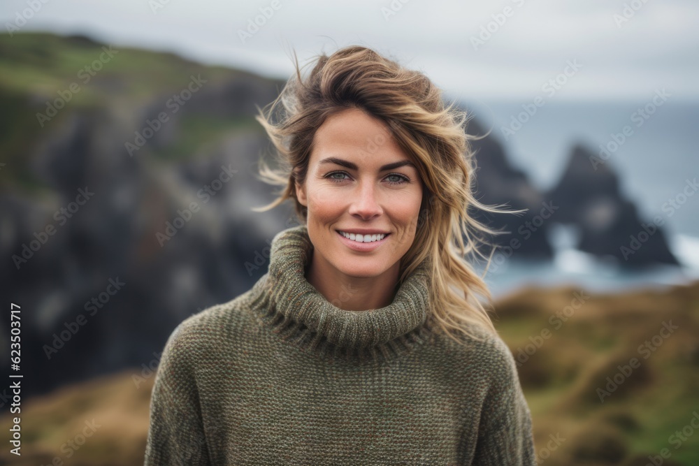 Headshot portrait photography of a satisfied girl in her 30s wearing a cozy sweater against a scenic cliffside village background. With generative AI technology