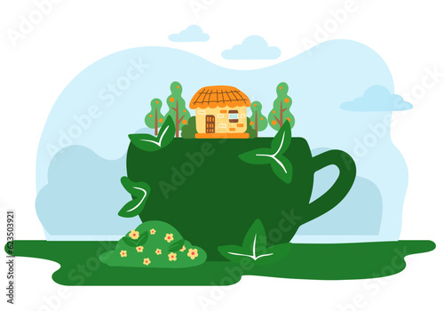 Garden figure of a cup, shrub sculpture green color with house, trees and bushes with flowers above. Artistic pruning of the bush in the shape of a coffee cup with a handle. Park design plant element