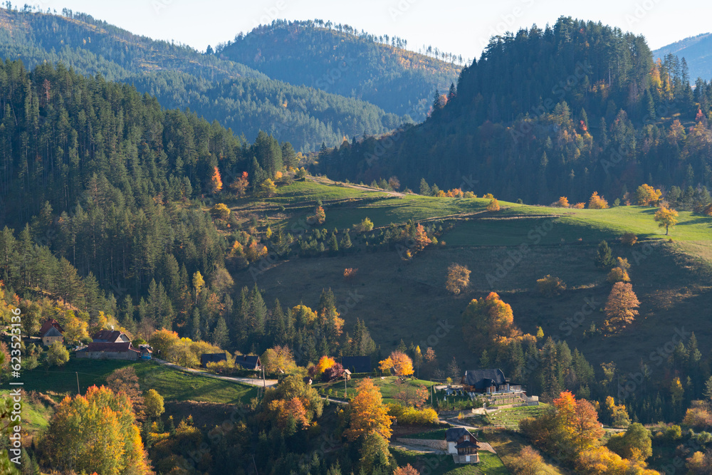 Autumn landscape with country houses in mountains