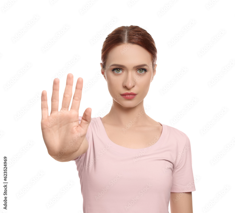 Woman showing stop gesture on white background Woman showing stop gesture on white background
