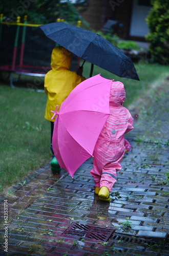 Toddlers under the rain