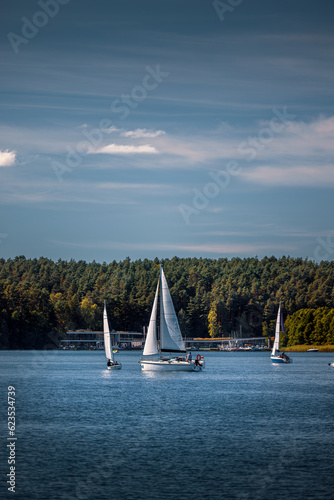 Sailboats on Lake Ukiel in Olsztyn. In the background are the buildings of the Sailing Centre.