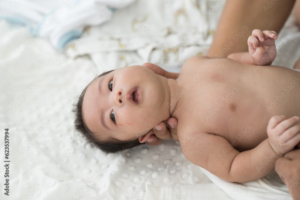 Hands of father takes care and change diaper newborn baby with carefully. Family, love and new life concept Hands of father takes care and change diaper newborn baby with carefully. Family, love and new life concept