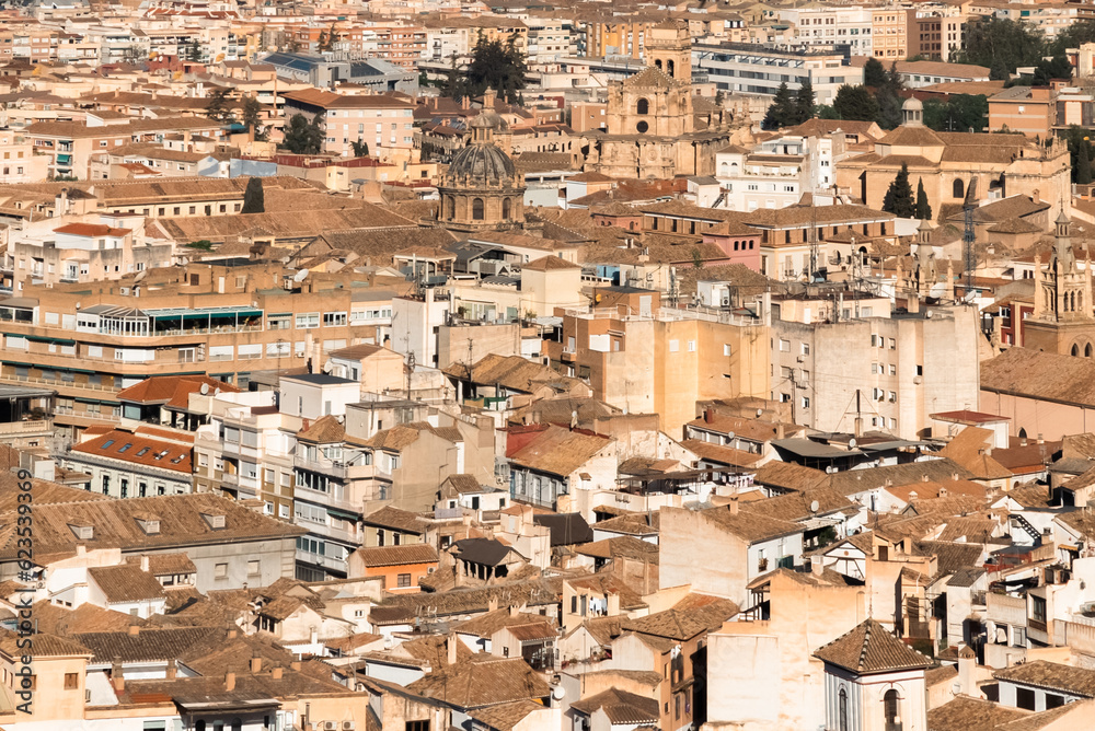 Panoramic landscape of Granada, Spain with blue sky.